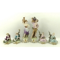 A group of four 20th century Capodimonte figurines, after models by D. Bellaine, in two different co... 