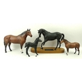 A group of matt finish Beswick horses, comprising 'Black Beauty and Foal', Conniosseur's model, on s... 