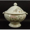 A Japanese tureen, 1920's, hard paste, hand painted with chrysanthemums, the lid with figures and a ... 