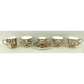 A group of five 19th and early 20th century assorted Royal Crown Derby cups, and a saucer, in the Im... 