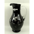 A flashed plum jug with wheel engraving, 28cm.