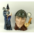 A Royal Doulton figurine of 'The Wizard', HN2877, modelled by A Maslonkowski, and a character mug of... 