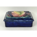 A Moorcroft trinket box with cover, early 20th century, decorated with tulip and berries, bearing or... 