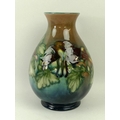 A Moorcroft vase, early 20th century, of weighted baluster form, decorated with fuchsias, with impre... 