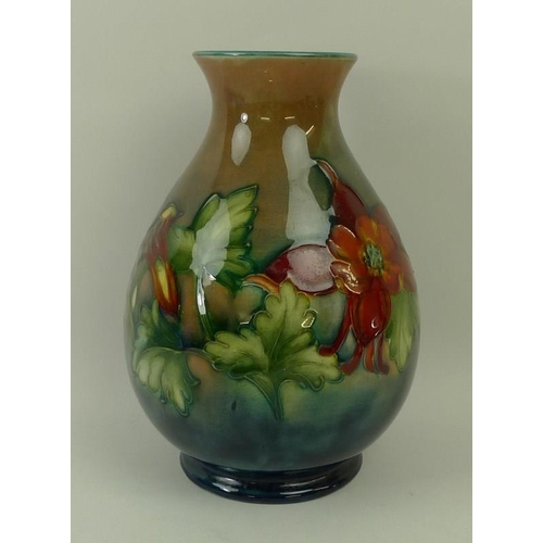 3 - A Moorcroft vase, early 20th century, of weighted baluster form, decorated with fuchsias, with impre... 