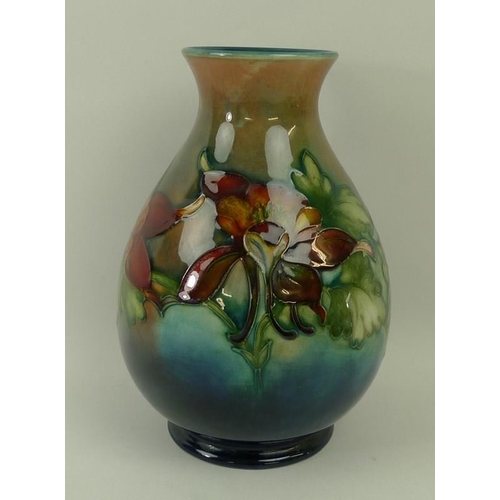 3 - A Moorcroft vase, early 20th century, of weighted baluster form, decorated with fuchsias, with impre... 