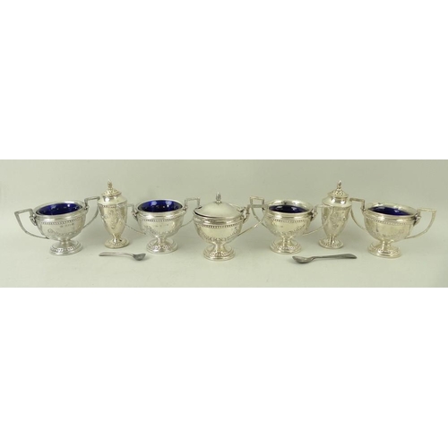 367 - A seven piece silver cruet set decorated with embossed garlands and beading, comprising four table s... 