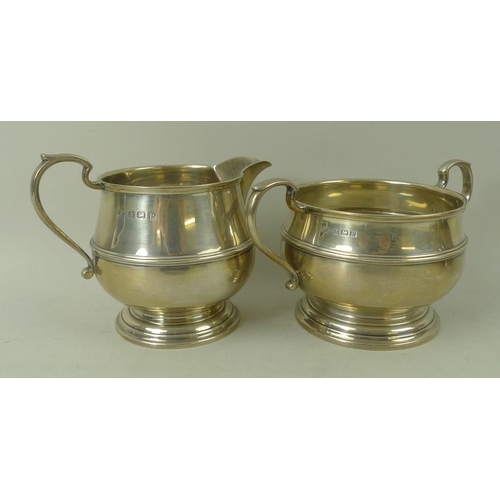 383 - A three piece silver tea service, teapot with wooden handle and finial, Birmingham 1939, S Ld for Wi... 