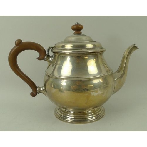 383 - A three piece silver tea service, teapot with wooden handle and finial, Birmingham 1939, S Ld for Wi... 