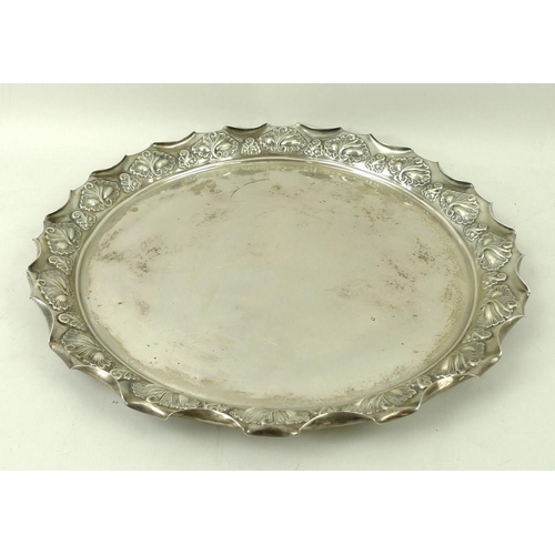 387 - A Victorian silver circular tray, with rolled over wave edge and embossed shell decoration, Birmingh... 