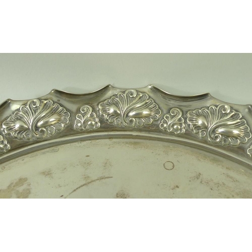 387 - A Victorian silver circular tray, with rolled over wave edge and embossed shell decoration, Birmingh... 