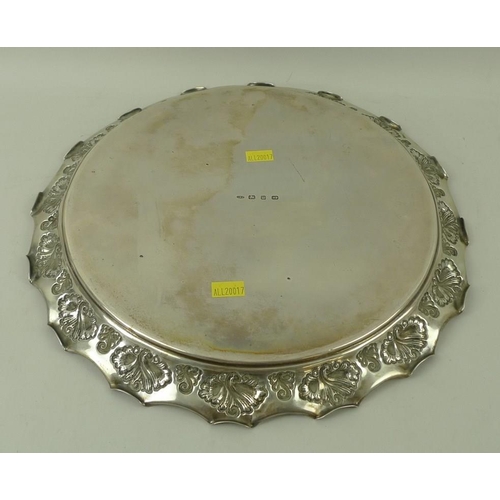 387 - A Victorian silver circular tray, with rolled over wave edge and embossed shell decoration, Birmingh... 