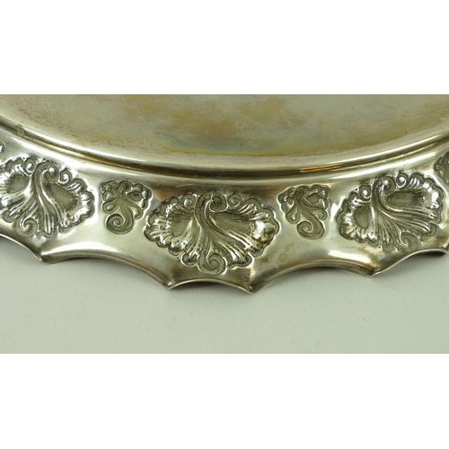 387 - A Victorian silver circular tray, with rolled over wave edge and embossed shell decoration, Birmingh... 