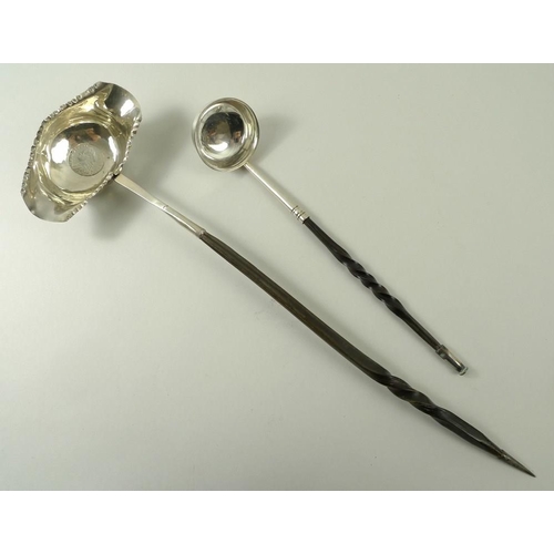 391 - A Georgian white metal toddy spoon with twisted horn handle with inset Georgian coin, 34cm, and a si... 