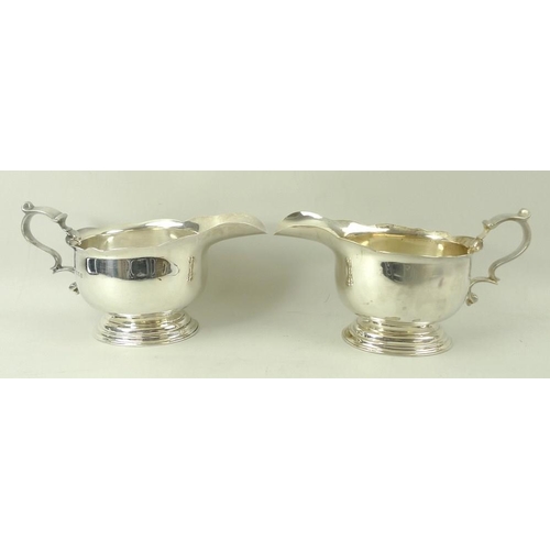 394 - A pair of silver sauce boats, on oval stepped base, London 1922, LAC for Lionel Alfred Crichton, sta... 