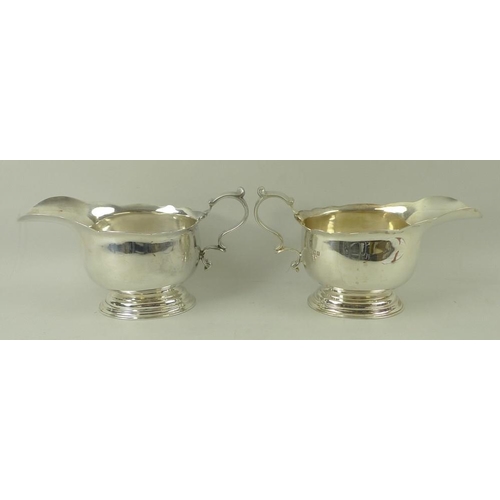 394 - A pair of silver sauce boats, on oval stepped base, London 1922, LAC for Lionel Alfred Crichton, sta... 