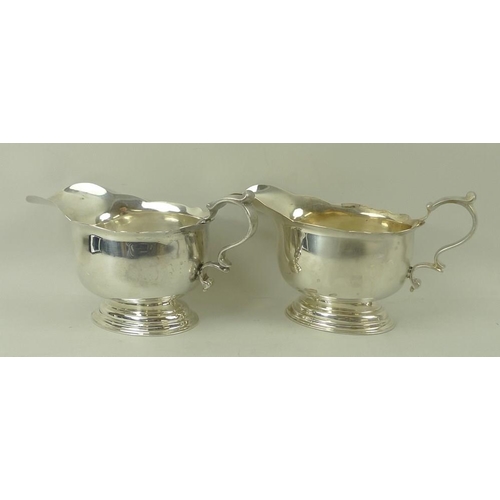 394 - A pair of silver sauce boats, on oval stepped base, London 1922, LAC for Lionel Alfred Crichton, sta... 