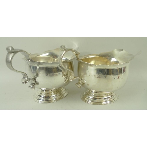 394 - A pair of silver sauce boats, on oval stepped base, London 1922, LAC for Lionel Alfred Crichton, sta... 