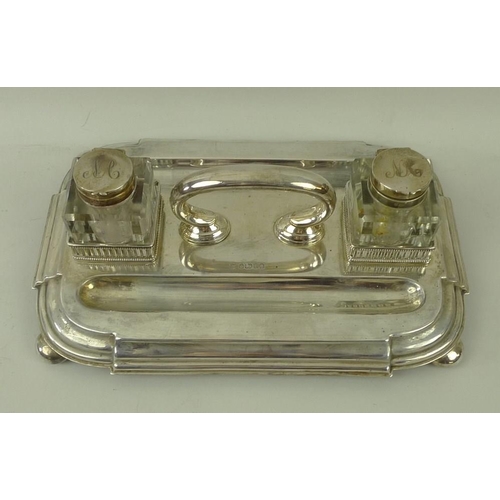 395 - A Victorian silver desk stand, with handle two pen wells, and two square cut glass inkwells with sil... 