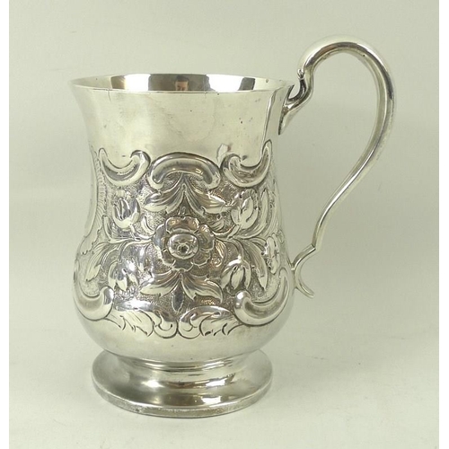 401 - A silver tankard, embossed with floral and foliate scrolling with vacant reserve, of baluster form, ... 