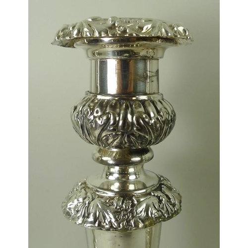 409 - A group of four Victorian silver candlesticks, with detachable candle holder to top, above a stem wi... 