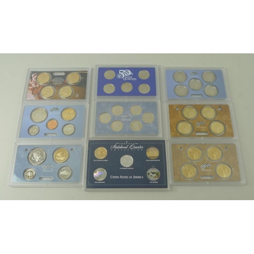 415 - A collection of coins, comprising two sets of United States mint silver proof coin set 2006, two set... 