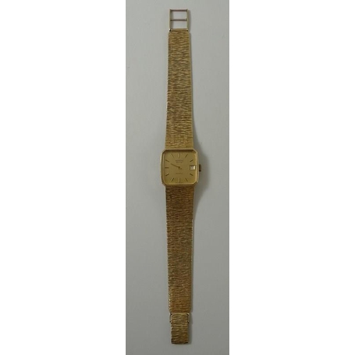 440 - A Marvin Revue wristwatch, the square with baton numerals and date aperture, on a 9ct gold bracelet ... 