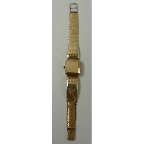 440 - A Marvin Revue wristwatch, the square with baton numerals and date aperture, on a 9ct gold bracelet ... 