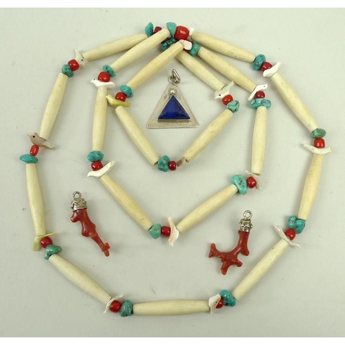 448 - An American tribal necklace with turquoise and glass beads and agate birds, separated by bone channe... 