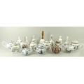 A collection of eleven Victoria and Albert museum teapots, Franklin mint with eleven certificates, t... 