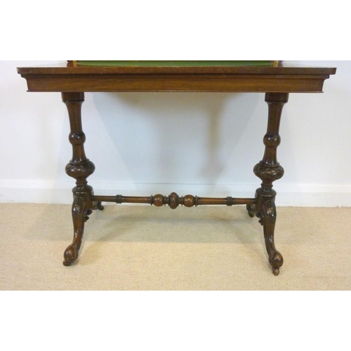 652 - An early Victorian walnut fold over card table, the rectangular top of burr walnut, inlaid with a qu... 