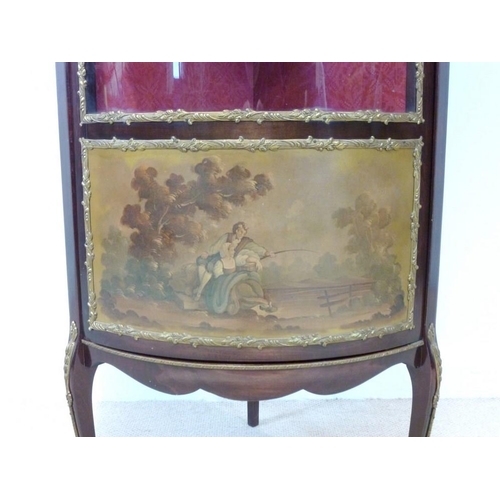 653 - A Louis XVI style, mid 20th century, cylinder front corner display cabinet, with gilded metal mounts... 