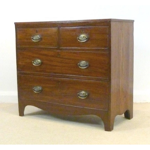 655 - A 19th century mahogany chest of two short over two long drawers, with oval brass handles, each embo... 