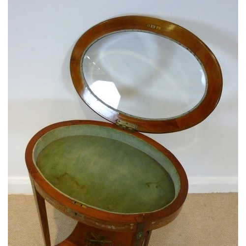 657 - An early 20th century satin walnut veneered vitrine, painted with garlands and ribbons, the lift lid... 