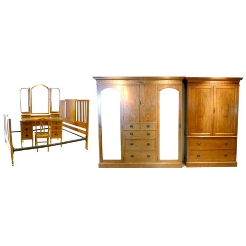 659 - An Edwardian satinwood and marquetry inlaid bedroom suite, comprising double compactum with fitted i... 