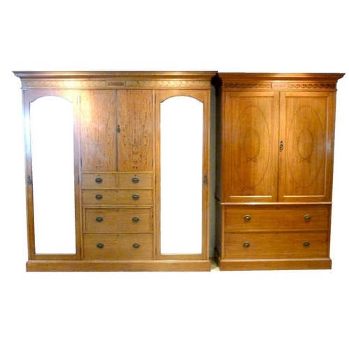 659 - An Edwardian satinwood and marquetry inlaid bedroom suite, comprising double compactum with fitted i... 