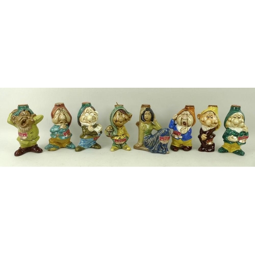 66 - A group of eight ceramic liquor bottles, hand painted and modelled as  Snow White and the Seven Dwar... 