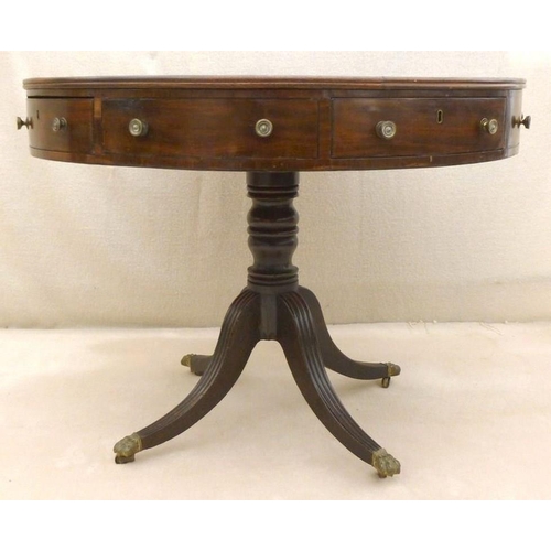 661 - A late Georgian mahogany drum library table, later green leather surface, four drawers with cast bra... 