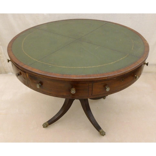 661 - A late Georgian mahogany drum library table, later green leather surface, four drawers with cast bra... 