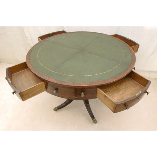 661 - A late Georgian mahogany drum library table, later green leather surface, four drawers with cast bra... 