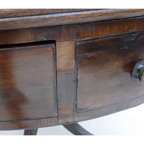 661 - A late Georgian mahogany drum library table, later green leather surface, four drawers with cast bra... 