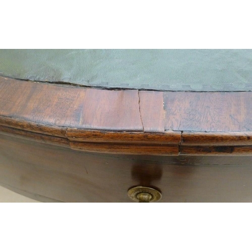 661 - A late Georgian mahogany drum library table, later green leather surface, four drawers with cast bra... 