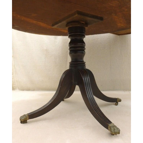 661 - A late Georgian mahogany drum library table, later green leather surface, four drawers with cast bra... 