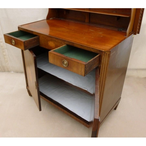 662 - A French 19th century mahogany and inlaid commode / dressing cupboard of canted edge form, with lift... 