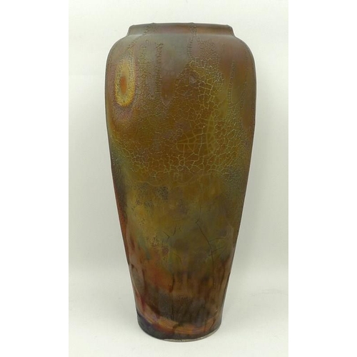 73 - A Raku studio pottery vase of shouldered, tapering form with a textured iridescent lava glaze, JG se... 