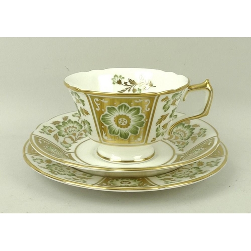 74 - A Royal Crown Derby part tea service, in the Green Derby Panel pattern, comprising a cake plate, mil... 