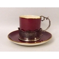 A Crown Devon Fielding's part coffee set, in maroon ground, the cups in silver holders, one with han... 