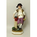 A Derby porcelain figurine, late 18th/early 19th century, modelled as a young man gardener with pott... 