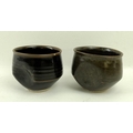 A near pair of Kenneth Quick Studio Pottery cups, mid 20th century, in brown glazed earthenware with... 