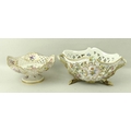 A Meissen pierced basket work fruit bowl, with hand painted sprays to the interior and raised floral... 